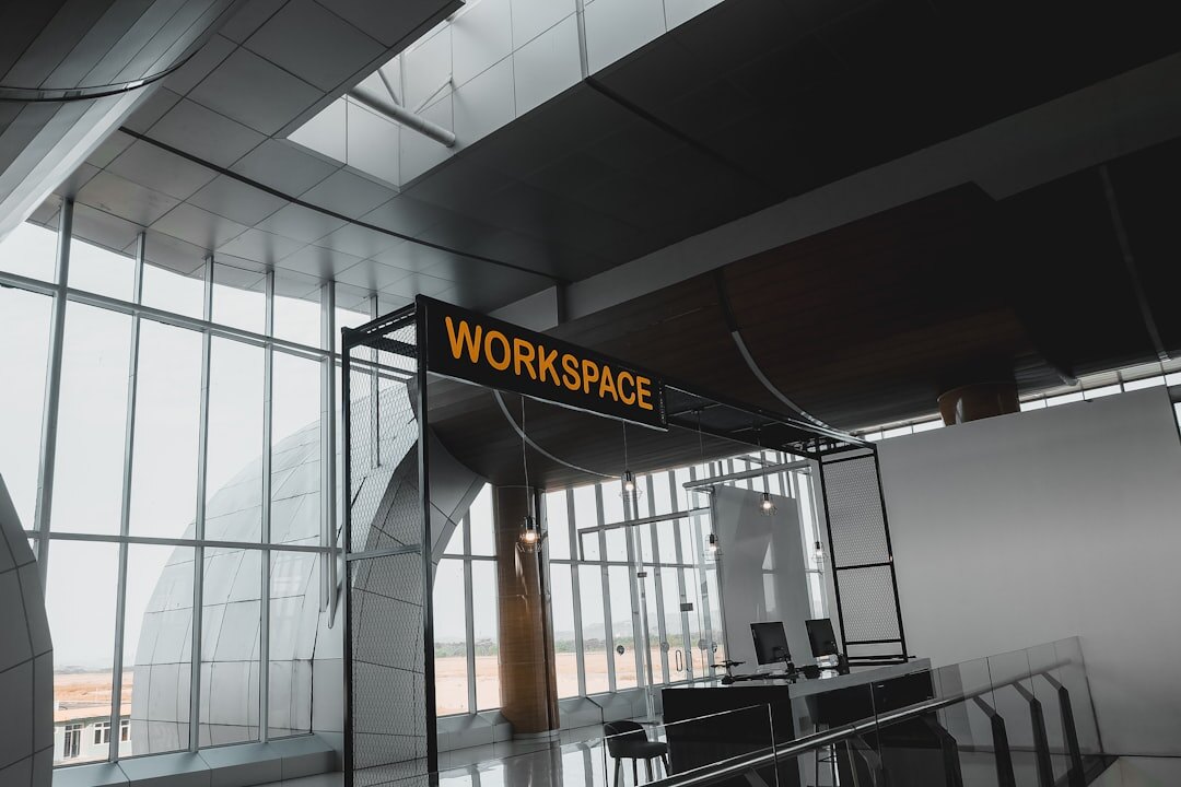 Modern media company office with screens and open workspace