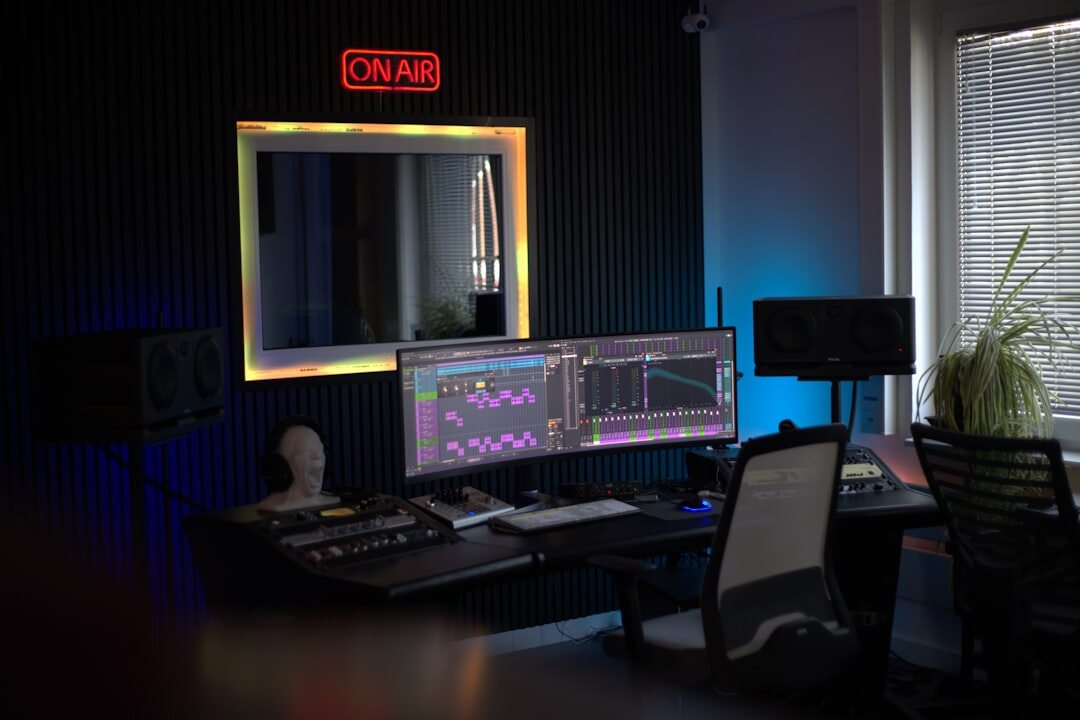 Podcast production space with multiple microphones and monitors